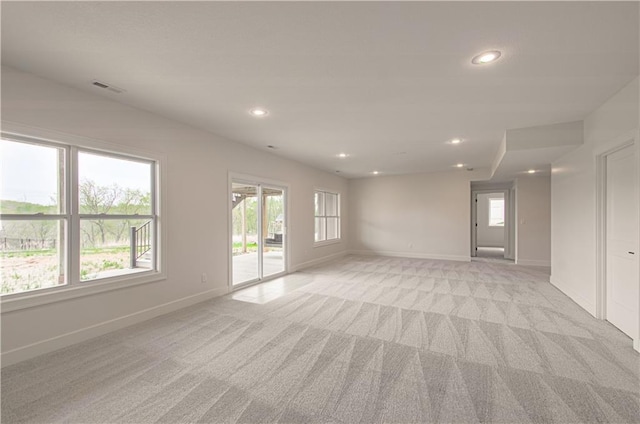 7551 NW Gower Ave, Kansas City, MO 64151 - empty room featuring baseboards, visible vents, light carpet, and recessed lighting