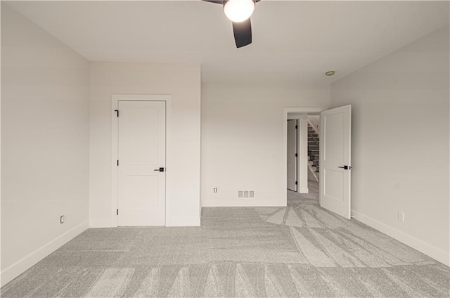 7551 NW Gower Ave, Kansas City, MO 64151 - unfurnished bedroom featuring a ceiling fan, visible vents, light carpet, and baseboards
