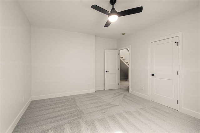 7551 NW Gower Ave, Kansas City, MO 64151 - unfurnished bedroom featuring a ceiling fan, carpet floors, and baseboards