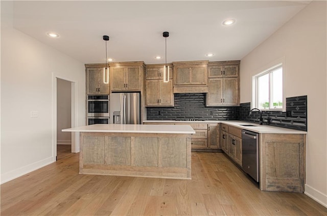 7551 NW Gower Ave, Kansas City, MO 64151 - kitchen with a sink, light wood-type flooring, backsplash, baseboards, and appliances with stainless steel finishes