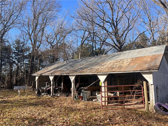 view of horse barn with an outdoor structure