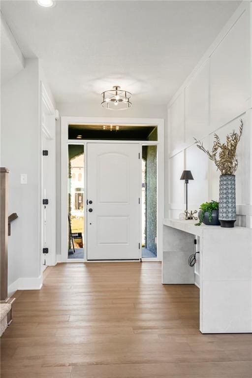 entrance foyer featuring light hardwood / wood-style flooring and plenty of natural light