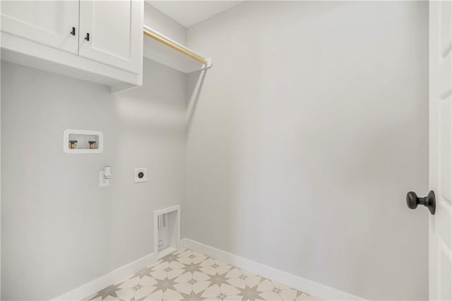 washroom featuring hookup for an electric dryer, washer hookup, and cabinets