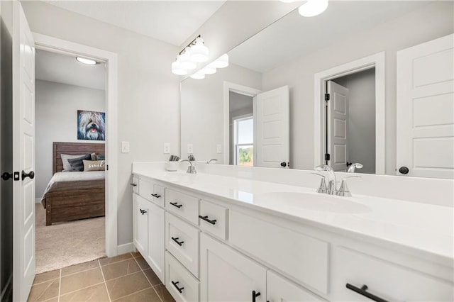 bathroom with vanity, toilet, and tile patterned floors