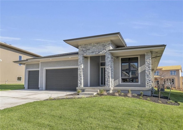 16879 S Cardinal St, Olathe, KS 66062 - prairie-style house with an attached garage, concrete driveway, a front lawn, stone siding, and stucco siding