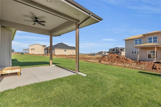 16879 S Cardinal St, Olathe, KS 66062 - view of grassy yard featuring a ceiling fan, a patio, and a residential view