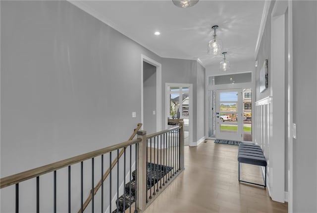 16879 S Cardinal St, Olathe, KS 66062 - hall featuring crown molding, wood finished floors, baseboards, recessed lighting, and an upstairs landing