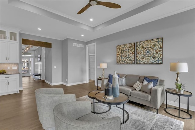 16879 S Cardinal St, Olathe, KS 66062 - living area featuring wood finished floors, ornamental molding, baseboards, ceiling fan, and recessed lighting