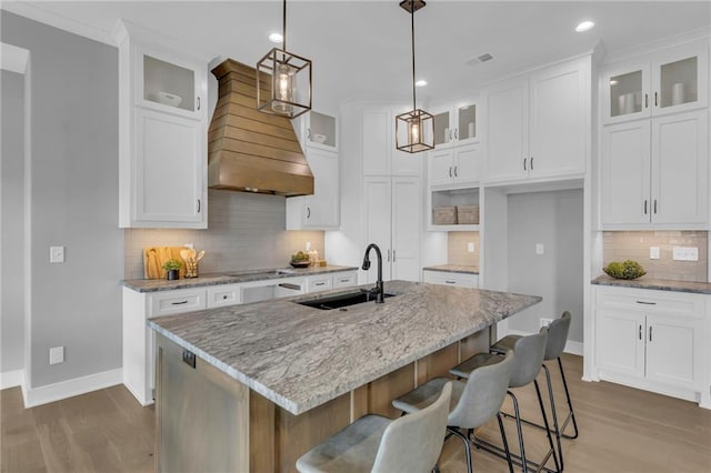 16879 S Cardinal St, Olathe, KS 66062 - kitchen with a sink, backsplash, wood finished floors, baseboards, and recessed lighting