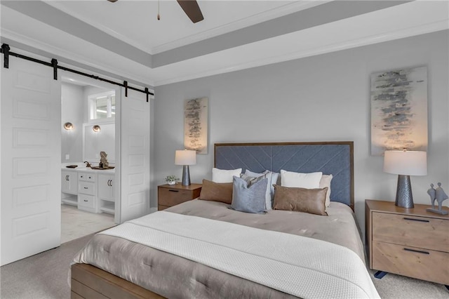 16879 S Cardinal St, Olathe, KS 66062 - bedroom featuring a barn door, carpet floors, crown molding, connected bathroom, and a ceiling fan