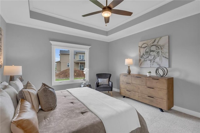 16879 S Cardinal St, Olathe, KS 66062 - bedroom featuring baseboards, a tray ceiling, light carpet, ornamental molding, and ceiling fan