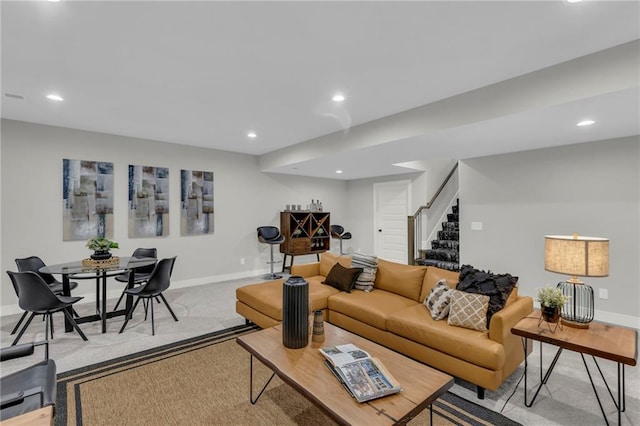 16879 S Cardinal St, Olathe, KS 66062 - carpeted living area featuring stairs, baseboards, and recessed lighting