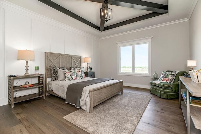 bedroom featuring dark hardwood / wood-style flooring, a chandelier, a raised ceiling, and crown molding