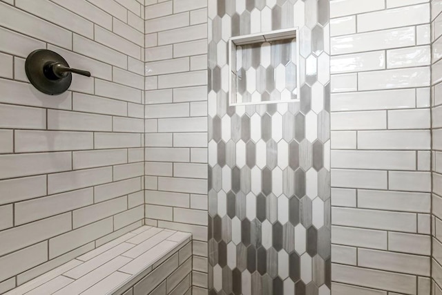 bathroom featuring a tile shower