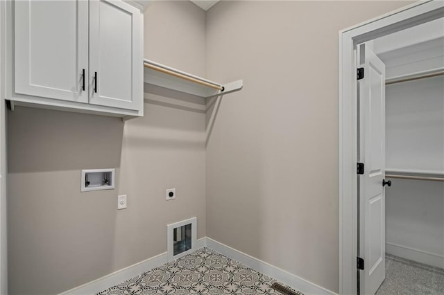 washroom featuring cabinets, hookup for an electric dryer, and washer hookup