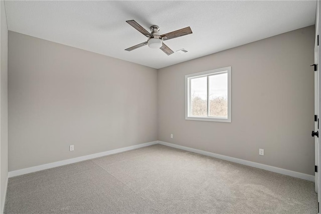 empty room with light carpet and ceiling fan