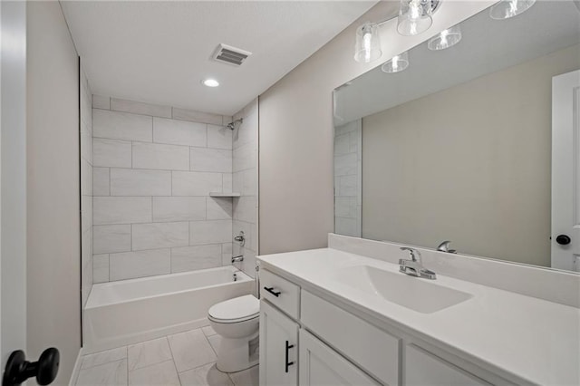 full bathroom featuring toilet, vanity, and tiled shower / bath combo