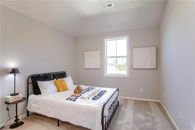 bedroom featuring light carpet