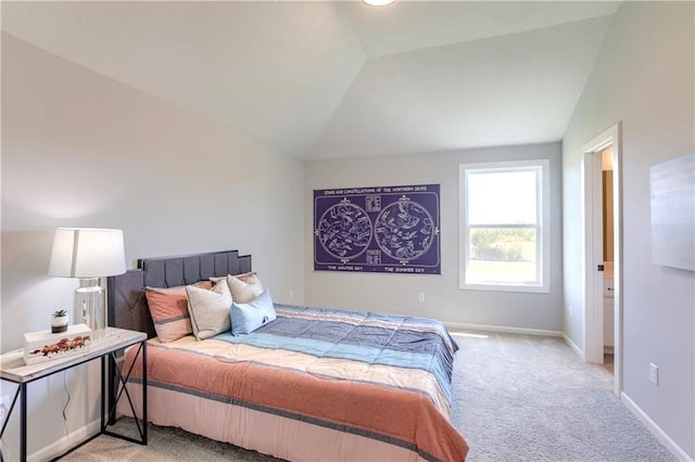 bedroom with vaulted ceiling and light carpet