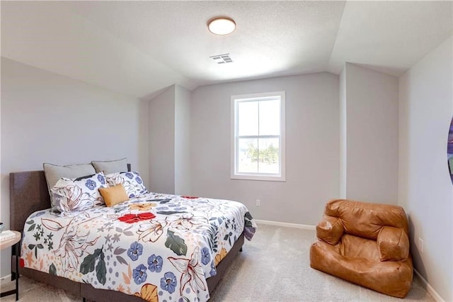 carpeted bedroom featuring vaulted ceiling