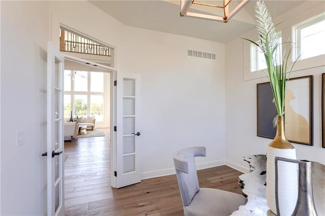 2461 W 176th St, Overland Park, KS 66085 - home office featuring a towering ceiling, visible vents, wood finished floors, french doors, and baseboards
