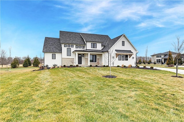 modern farmhouse style home with a front yard