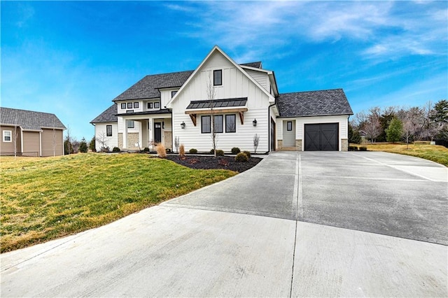 modern farmhouse style home with a garage and a front lawn