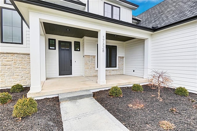 property entrance featuring covered porch