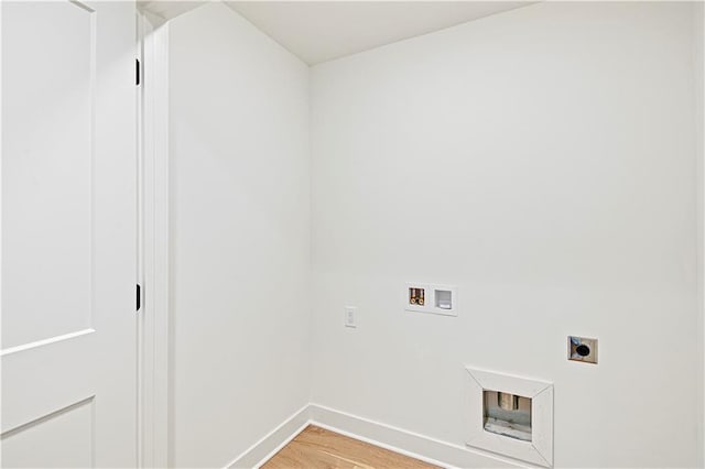 clothes washing area with hardwood / wood-style floors, washer hookup, and hookup for an electric dryer