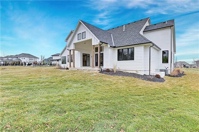 back of property with a lawn, a patio, and central air condition unit