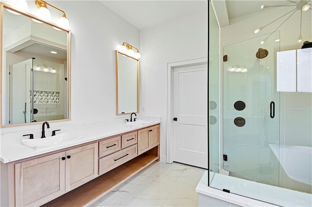 bathroom featuring vanity and a shower with shower door