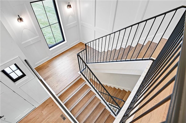 stairs featuring wood-type flooring