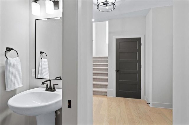 bathroom with wood-type flooring and sink