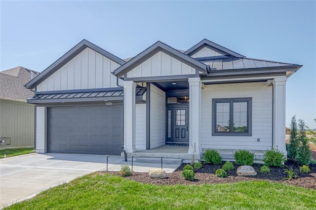 view of front of home featuring a garage and a front lawn