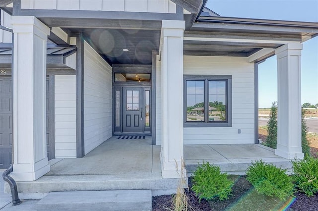 doorway to property with a porch