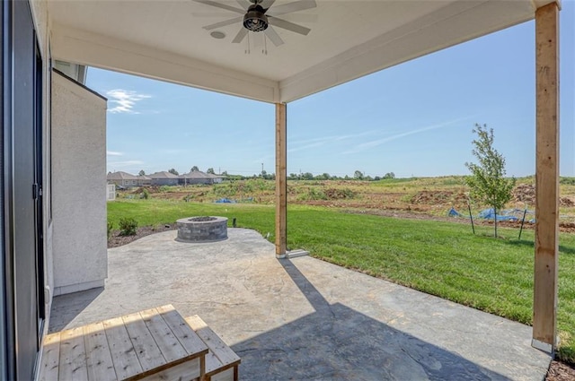 view of patio / terrace featuring ceiling fan and an outdoor fire pit