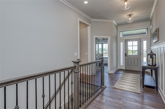 foyer featuring dark hardwood / wood-style flooring and ornamental molding