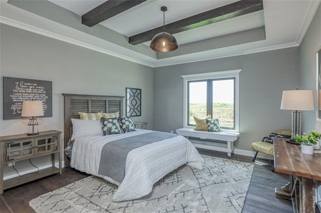 bedroom featuring dark hardwood / wood-style floors, a raised ceiling, and ornamental molding