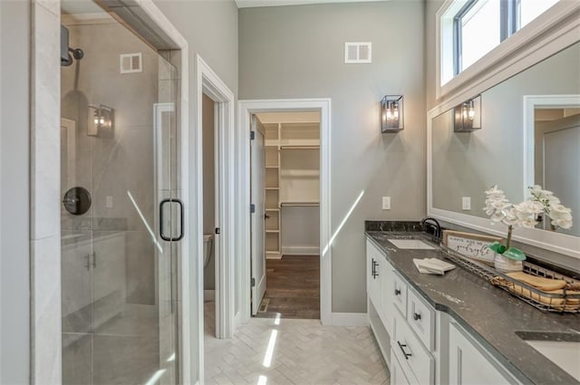 bathroom featuring vanity and walk in shower