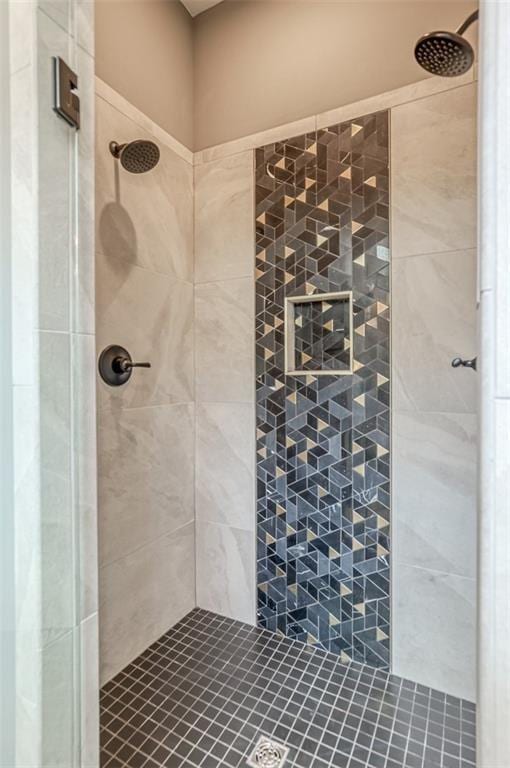 bathroom with tiled shower