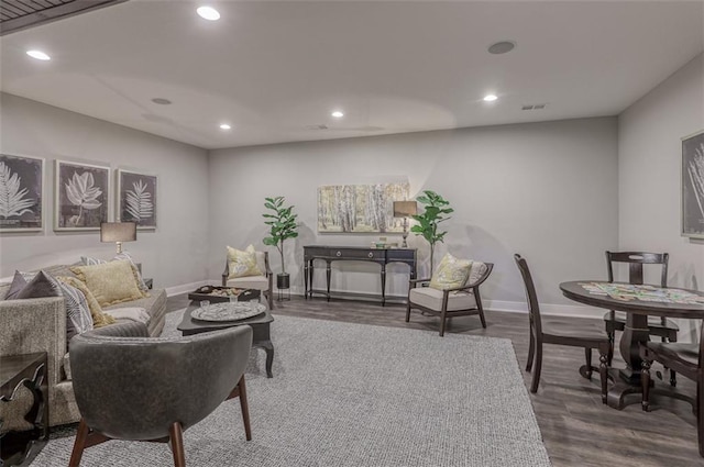 living room with dark hardwood / wood-style flooring