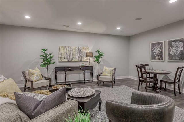 living room with dark hardwood / wood-style flooring