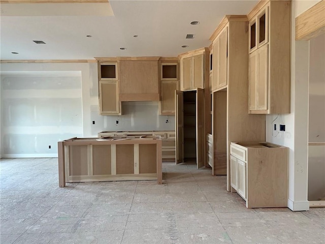 kitchen featuring light brown cabinetry