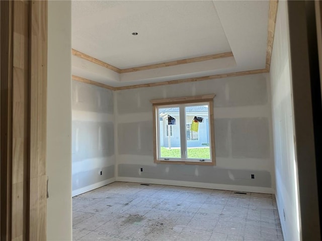 unfurnished room with crown molding