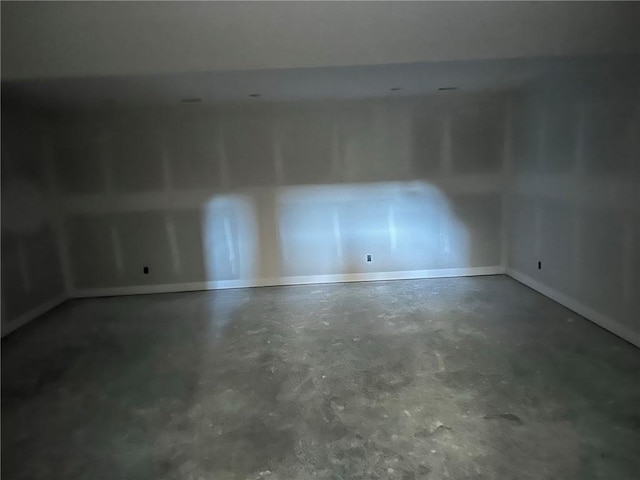 spare room with concrete floors