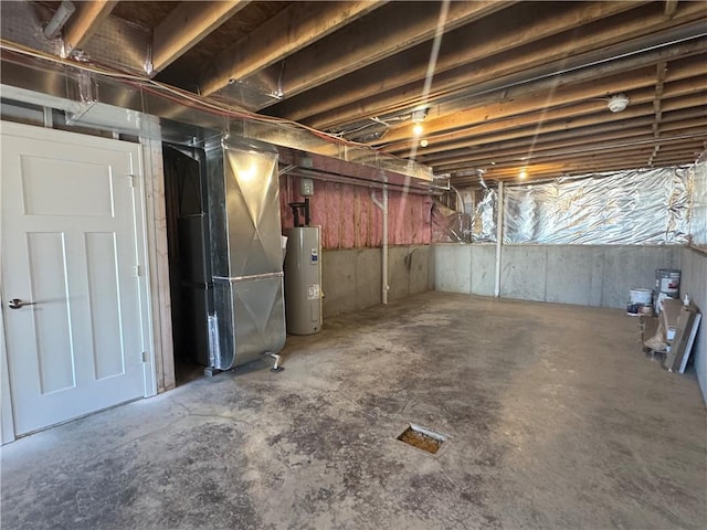 basement with electric water heater and heating unit