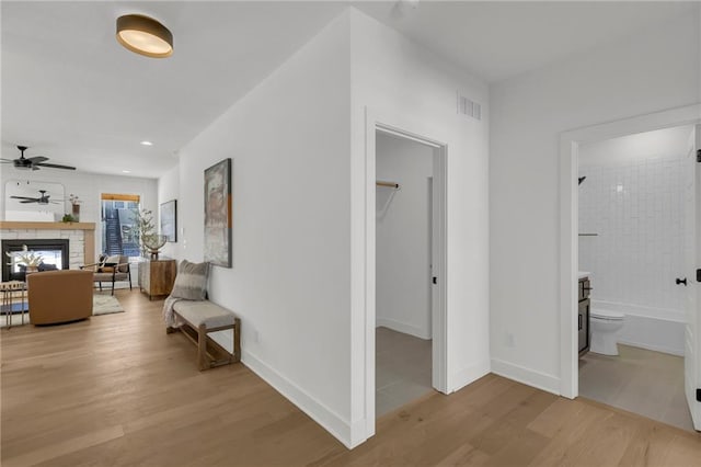 corridor with light wood-type flooring