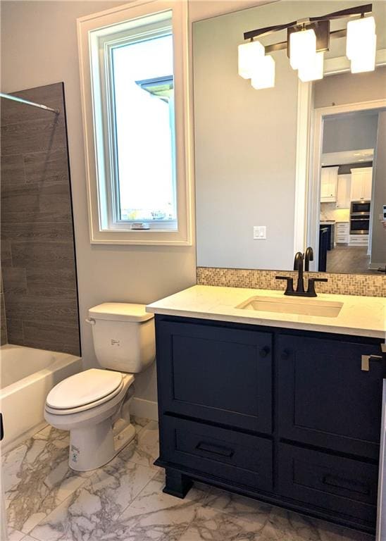 full bathroom featuring vanity, bathing tub / shower combination, and toilet