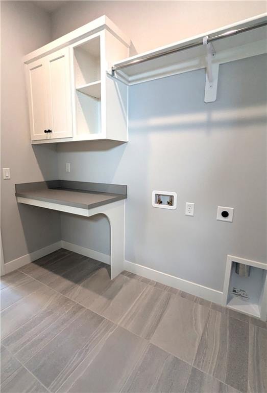 laundry room with hookup for a washing machine, cabinets, and hookup for an electric dryer