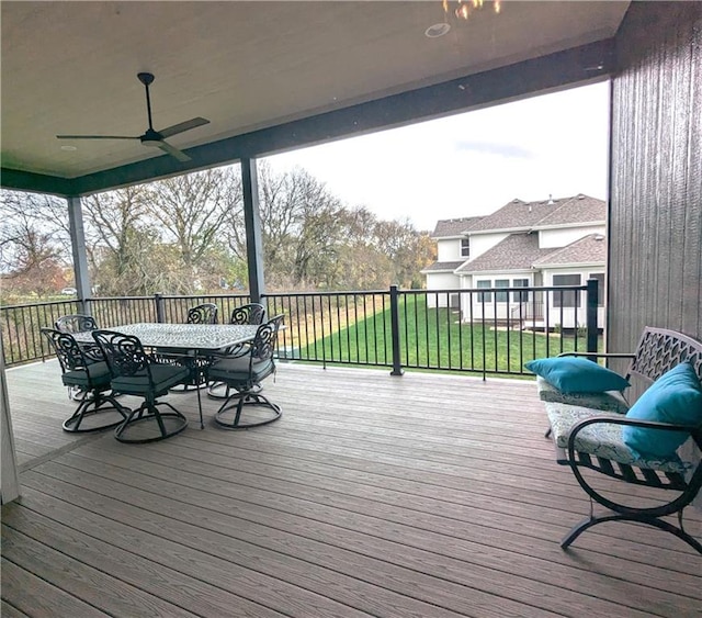 deck featuring a yard and ceiling fan